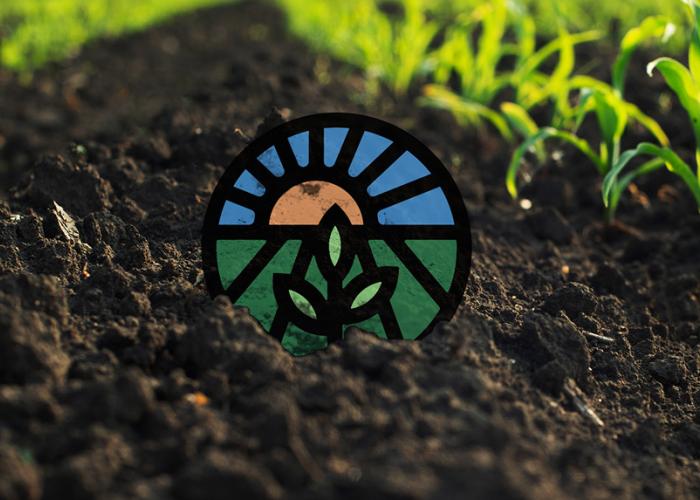 ota logo in dirt/field